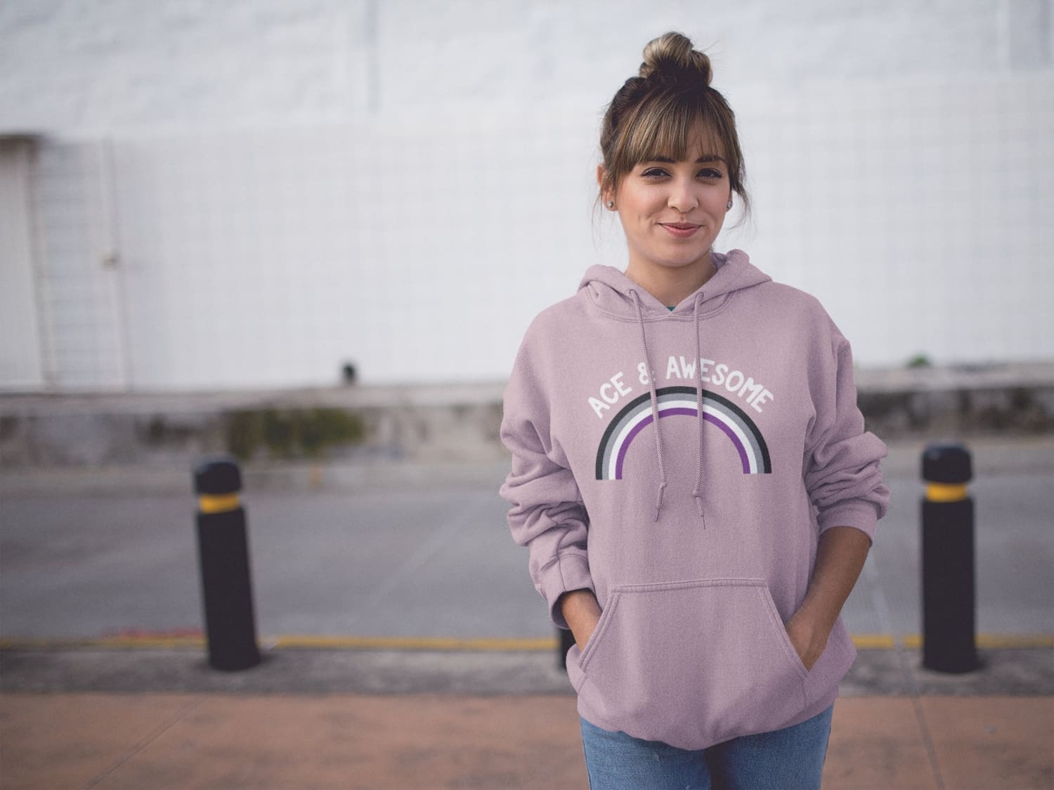 Man wearing gay pride hoodie with rainbow 'freedom' graphic.