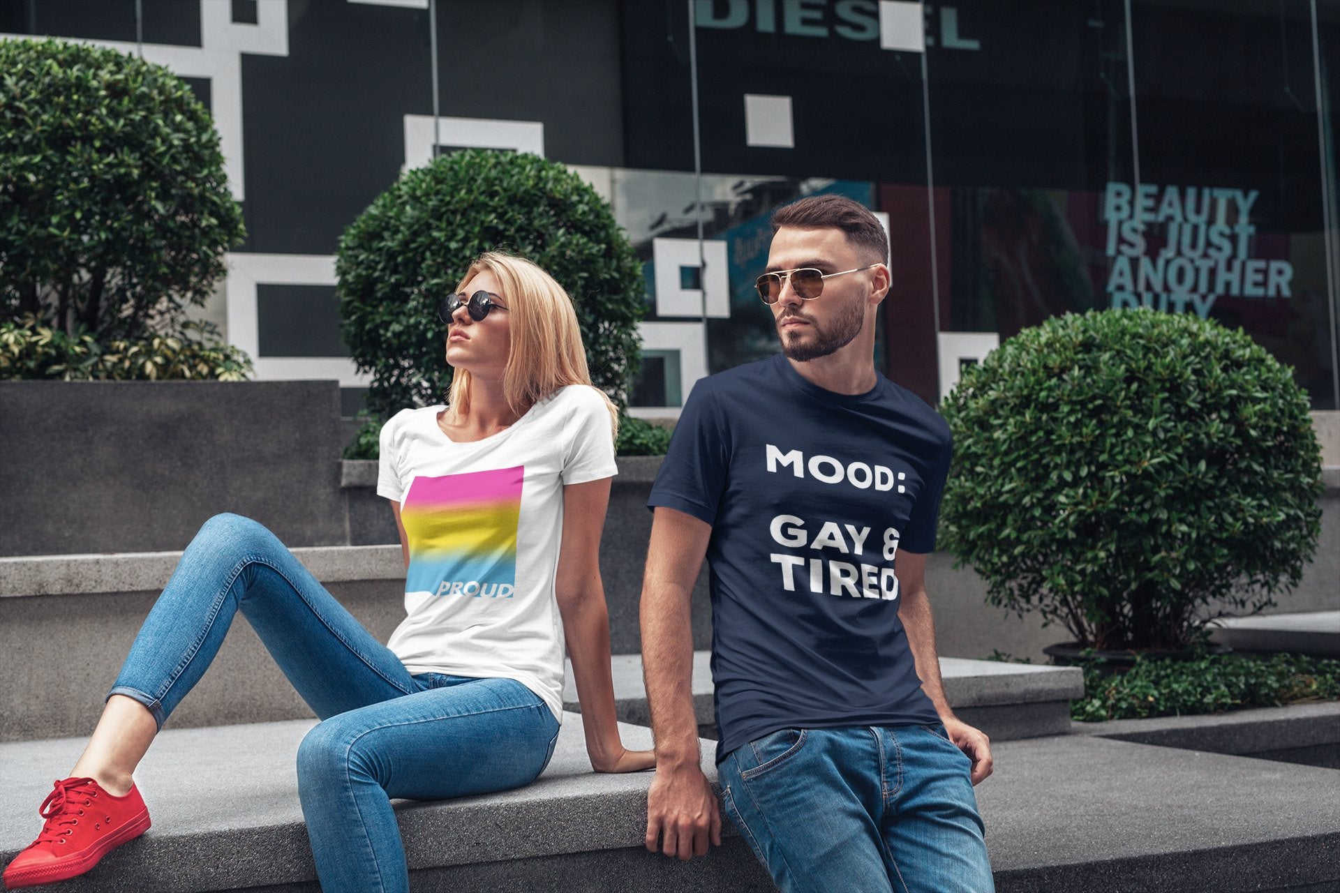 Man wearing gay pride shirt with text reading 'Mood: Gay & Tired'