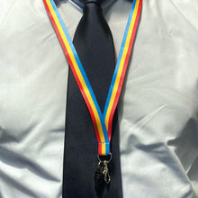Load image into Gallery viewer, Person wearing a lanyard in the colours of the pansexual flag over a shirt and tie.