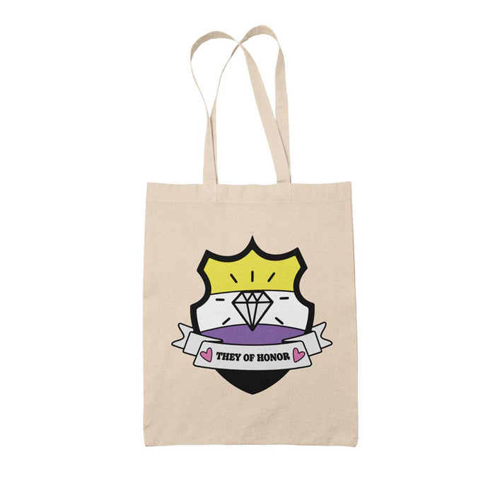 Natural coloured tote bag featuring a shield with a banner across it's front. Banner reads They of Honor. The background of the shield is the non binary pride flag and there is a jewel icon in the centre.