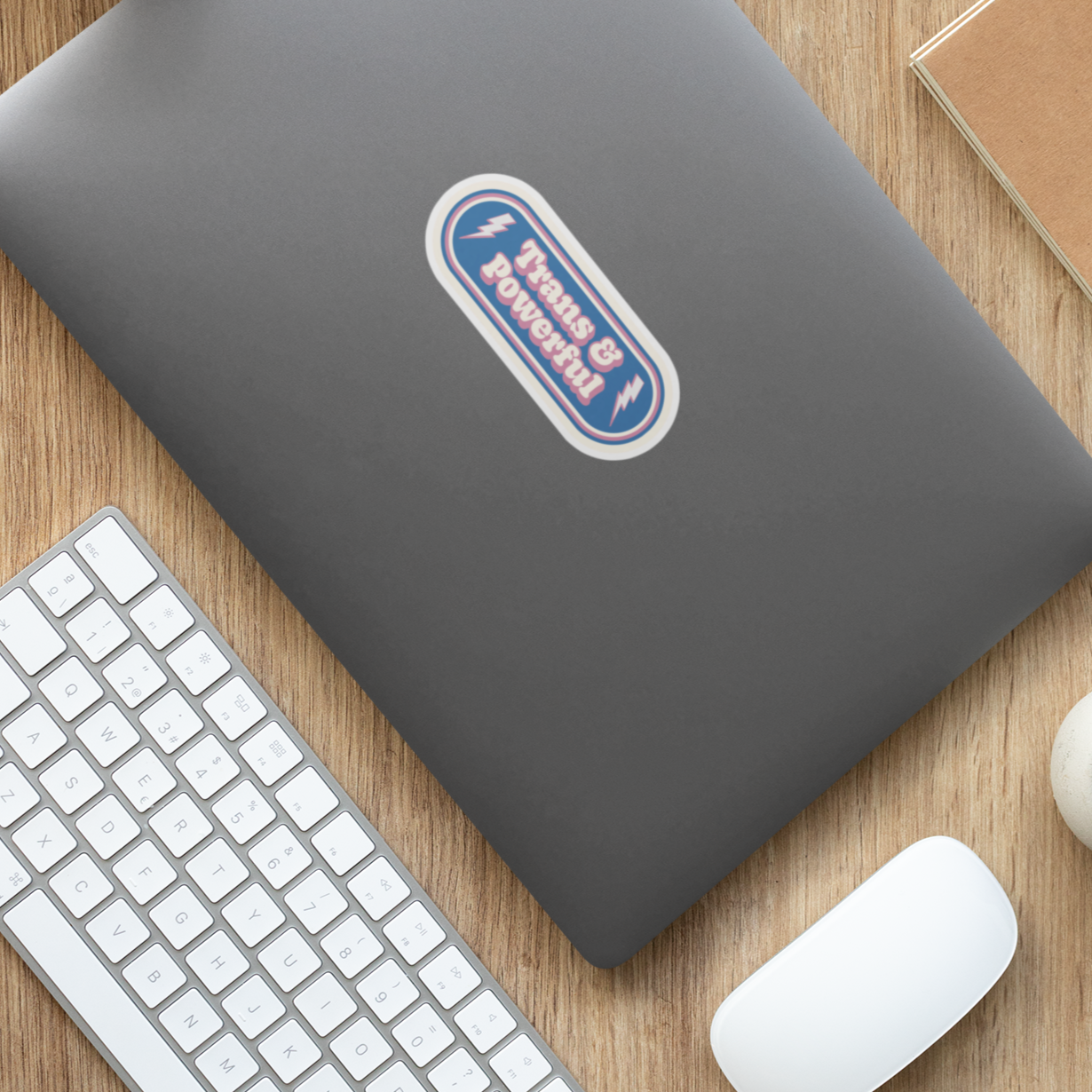Trans & Powerful sticker on a laptop lid