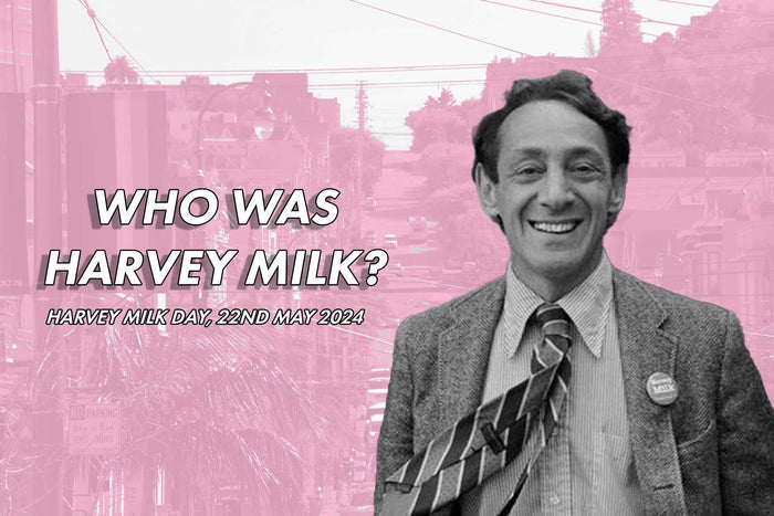 Photo of Harvey Milk on a pink background of San Francisco. Text reads Who Was Harvey Milk? - Harvey Milk Day, May 22nd 2024
