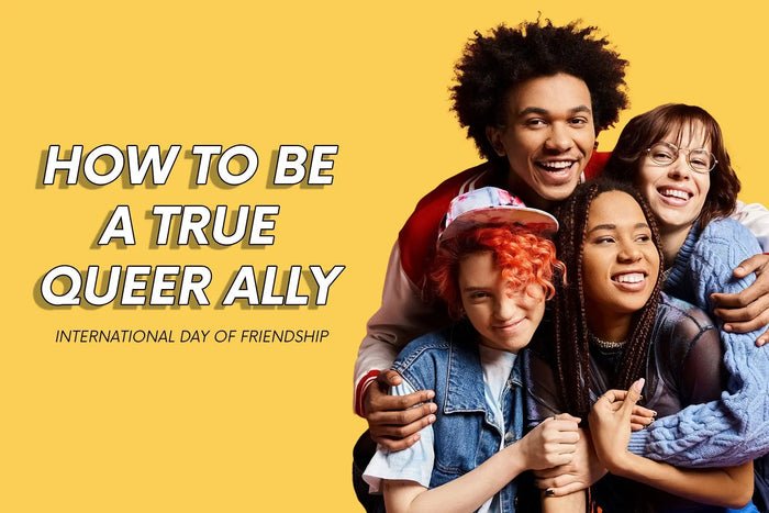 How To Be A True Queer Ally - International Day of Friendship. Image shows a diverse group of friends laughing and embracing.
