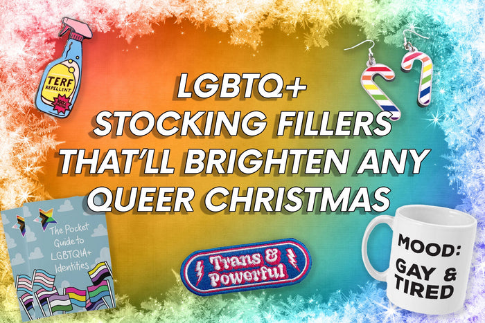 A vibrant image featuring a selection of LGBTQ+ stocking fillers against a rainbow gradient background with frosted white edges. The text reads: 