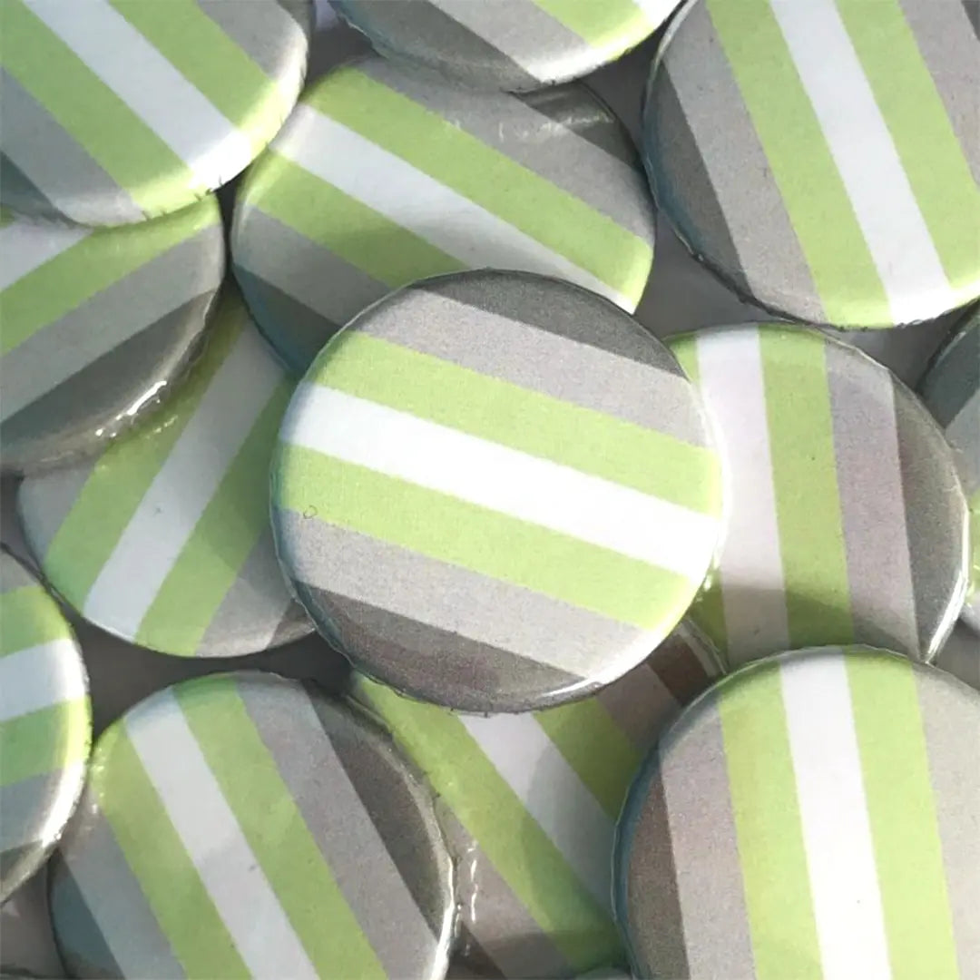 A pile of demiandrogyne flag badges