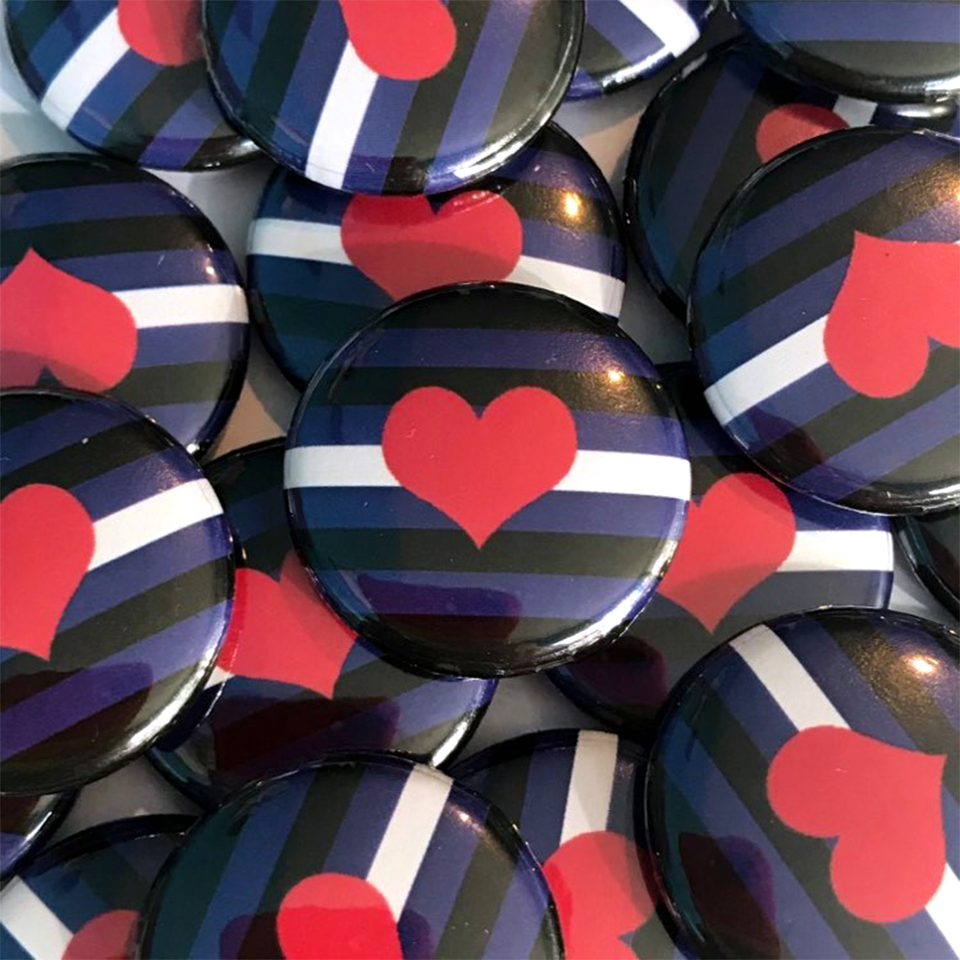 A pile of leather flag badges