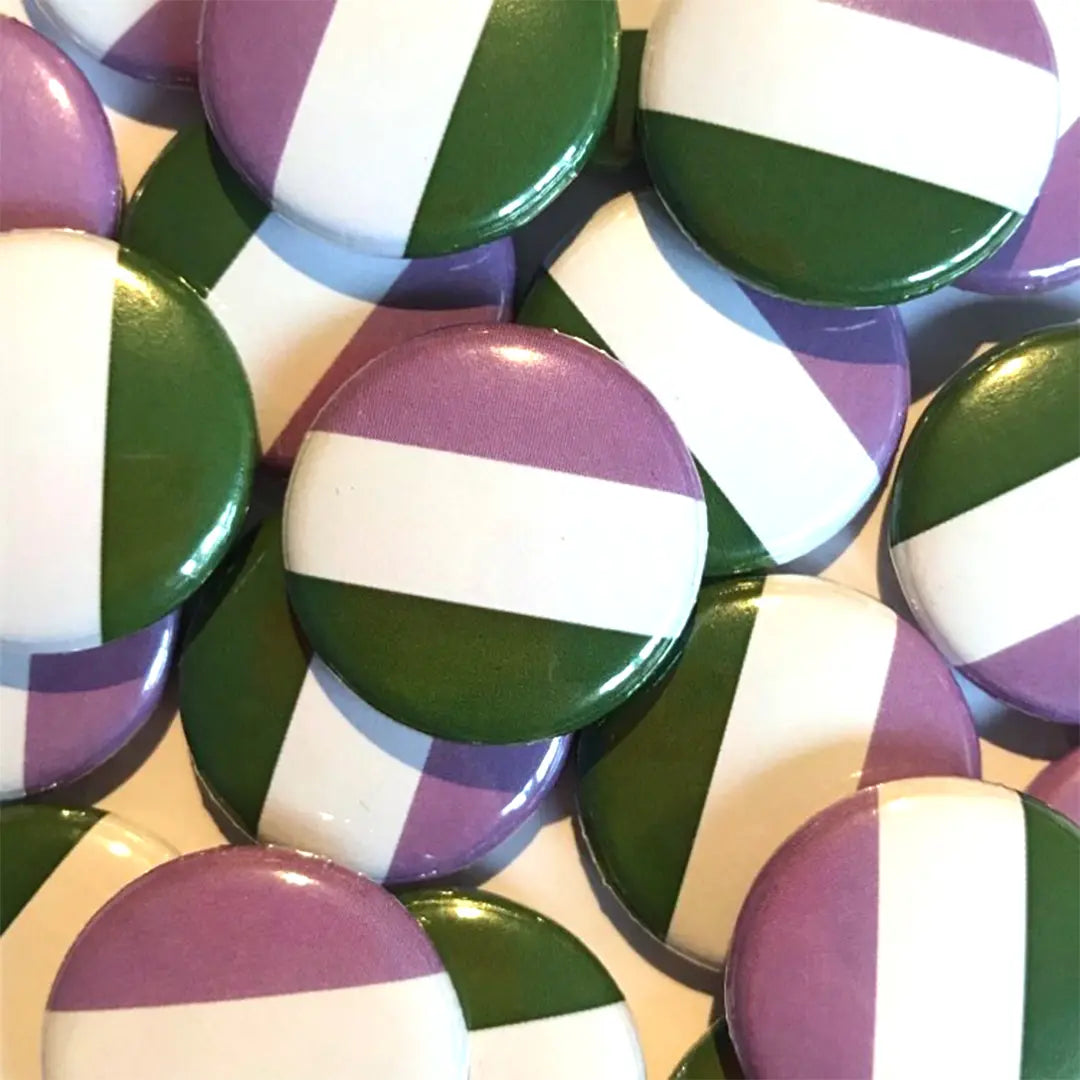 A pile of genderqueer flag badges