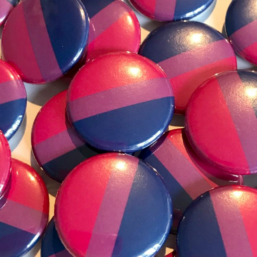 A pile of bisexual flag badges
