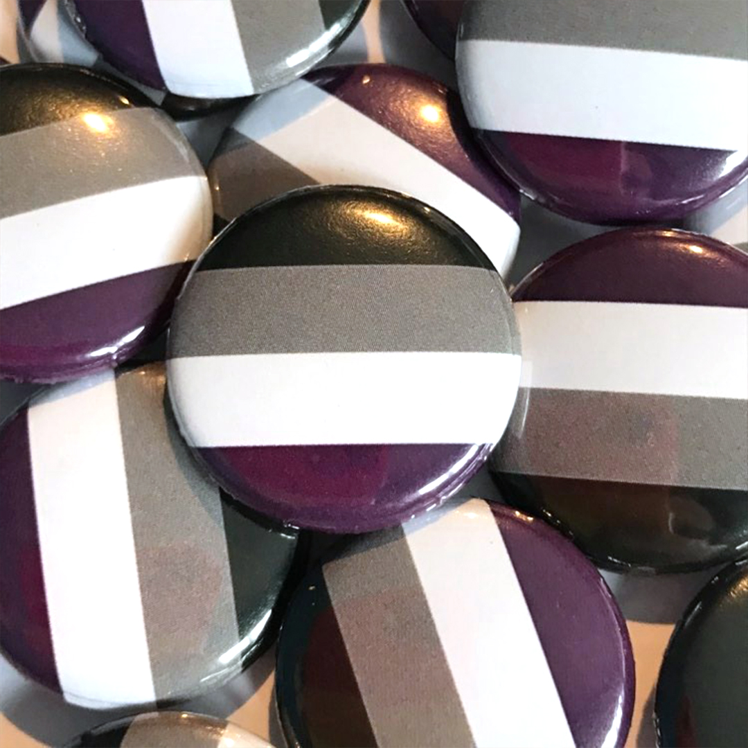 A pile of asexual flag badges