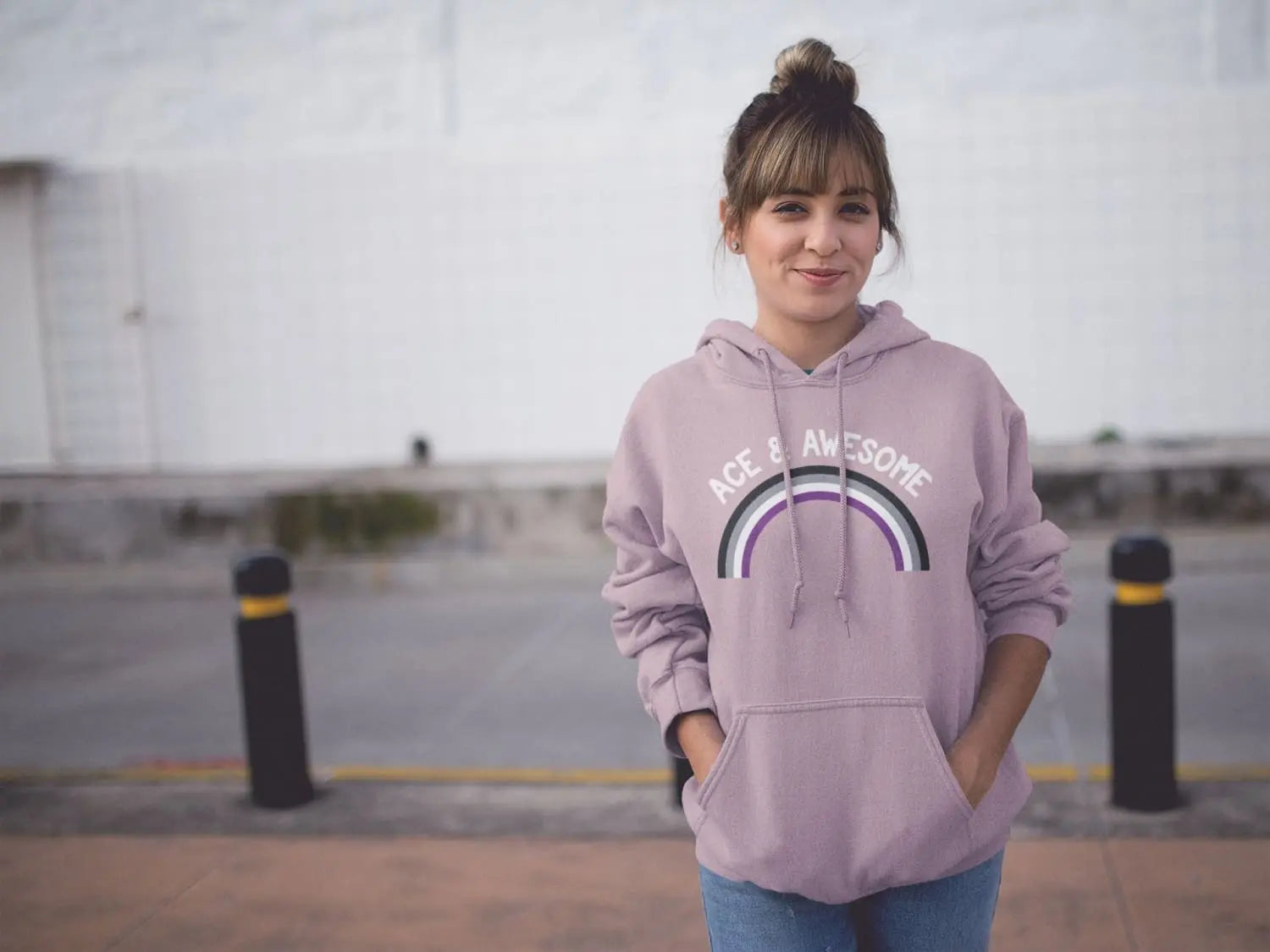 Man wearing gay pride hoodie with rainbow 'freedom' graphic.