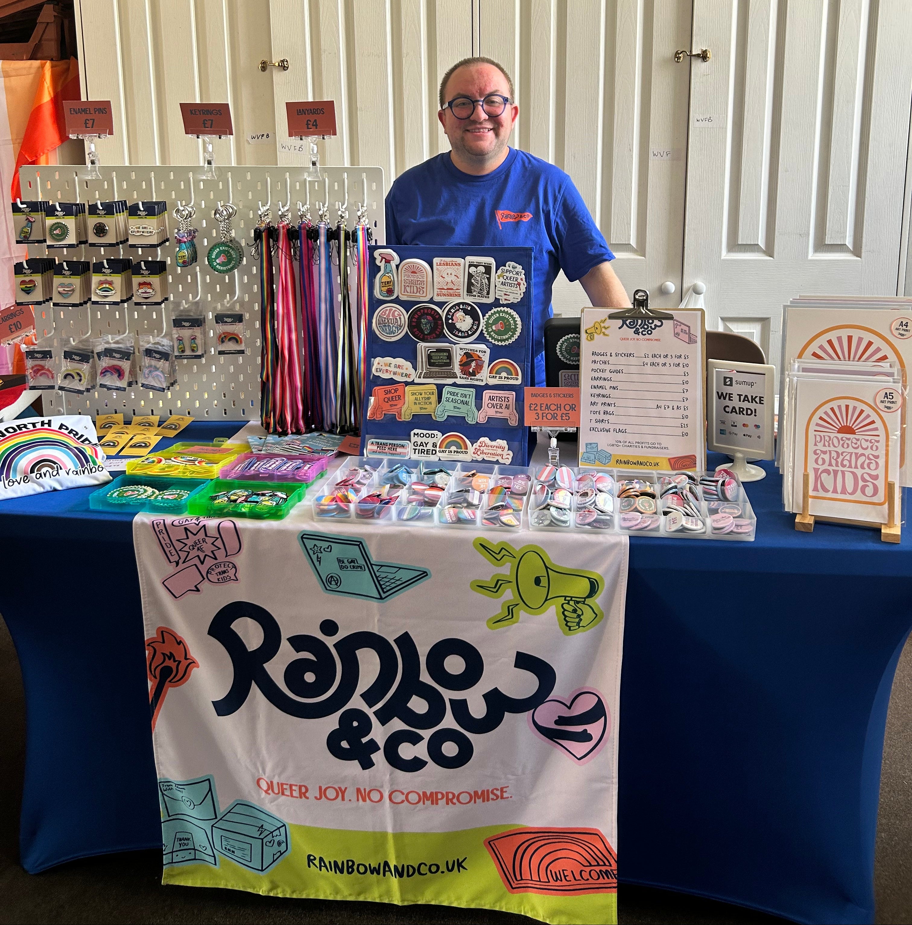 Adam standing behind the Rainbow & Co stall at Haworth Pride 2026