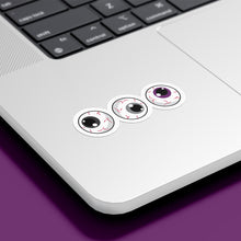 Load image into Gallery viewer, Three circular stickers with eyeball designs are placed on the bottom corner of a silver laptop. The irises are black, grey, and purple, representing the asexual pride flag.