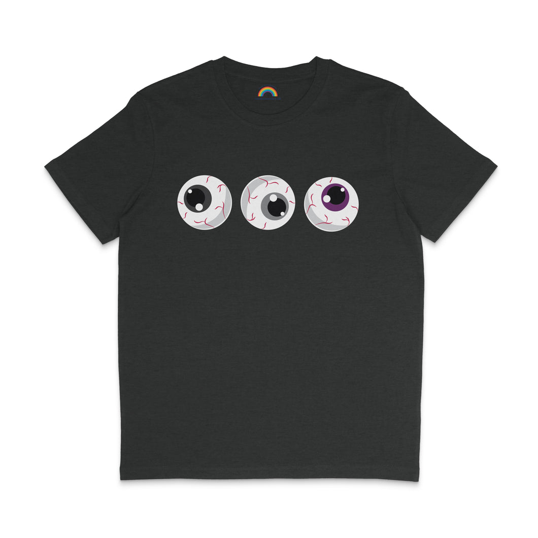 A dark heather grey t-shirt featuring three eyeballs with black, grey, and purple irises, representing the Asexual pride flag colours. The eyeballs are cartoonish with red veins, arranged horizontally across the chest.