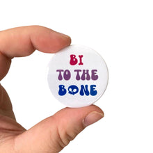 Load image into Gallery viewer, A white 38mm Badge with text reading &#39;Bi To The Bone&#39; on the colours of the bisexual flag