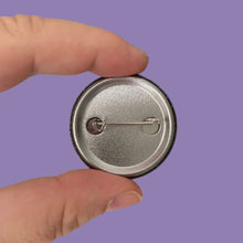 Load image into Gallery viewer, The reverse of a 38mm badge showing the fastening device.