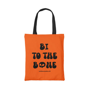 Orange cotton tote bag with a black handle featuring the slogan Bi To The Bone in blacktext