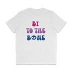 White crew neck shirt with pink, purple, and blue text reading Bi To The Bone. The I is in the shape of a bone, and the O in Bone is a skull.