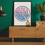 A framed Big Bisexual Energy poster on a dark green wall, adding a bold, retro aesthetic to the space.