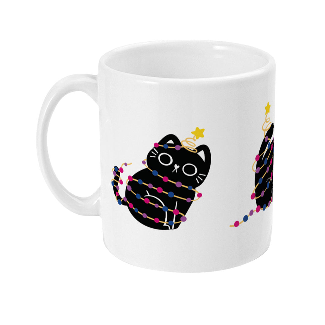 A white ceramic mug showing a black cat sitting upright and tangled in bisexual-themed Christmas lights, adorned with a star on its head. The lights are in pink, blue, and purple, representing the bisexual pride flag.