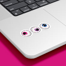 Load image into Gallery viewer, Three circular stickers with eyeball designs are placed on the bottom corner of a silver laptop. The irises are pink, purple, and blue, representing the bisexual pride flag.