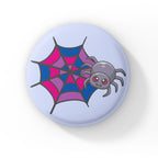 A circular badge with a cute grey spider with pink eyes on a web coloured in pink, purple, and blue, representing the bisexual pride flag. The badge has a light blue background.