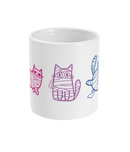 Load image into Gallery viewer, A white ceramic mug displaying a row of mummy cats outlined in pink and purple, matching the bisexual pride flag colours. Each cat is wrapped in bandages and positioned in a cute, playful stance, bringing a quirky, Halloween-themed vibe to the mug’s front side.