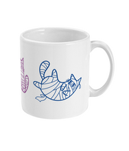 Load image into Gallery viewer, The right side of a white ceramic mug showing mummy cats wrapped in bandages, outlined in purple and blue. The cats are in various playful poses, completing the bisexual pride flag colour theme with a fun and spooky Halloween twist.