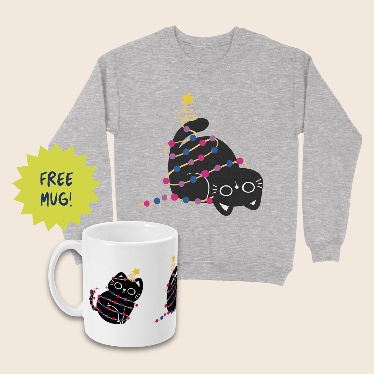 Grey Christmas jumper featuring an upside-down black cat wrapped in pink, purple and blue fairy lights, alongside a white mug with matching bisexual pride colours. Both sit on a cream background, with a lime-green starburst reading “FREE MUG!”