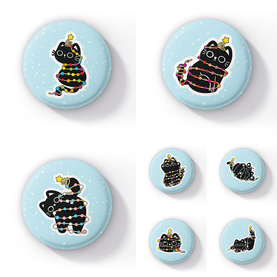 Image featuring a collection of round badges, each displaying a playful black cat tangled in colourful festive string lights, set against a light blue background with white snowflake-like spots. Each badge showcases the cat in different playful poses, with various pride flag colours represented in the lights, including rainbow, transgender, non-binary, and more.