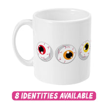 Load image into Gallery viewer, A white ceramic mug featuring three cartoon eyeballs with different coloured irises: one red, one orange, and one yellow. The design showcases playful and spooky elements. Below the mug, the text &quot;8 IDENTITIES AVAILABLE&quot; is displayed in bold, dripping pink letters, indicating that this design is part of a diverse collection with various options.