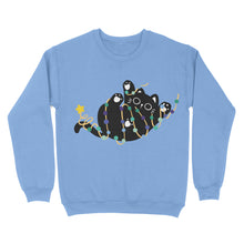 Load image into Gallery viewer, A light blue sweatshirt featuring a black cat tangled in festive string lights in gay pride colours, with a star on its tail.