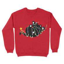 Load image into Gallery viewer, A bright red sweatshirt showcasing a black cat caught up in festive string lights of gay pride colours, with a star perched on its tail.