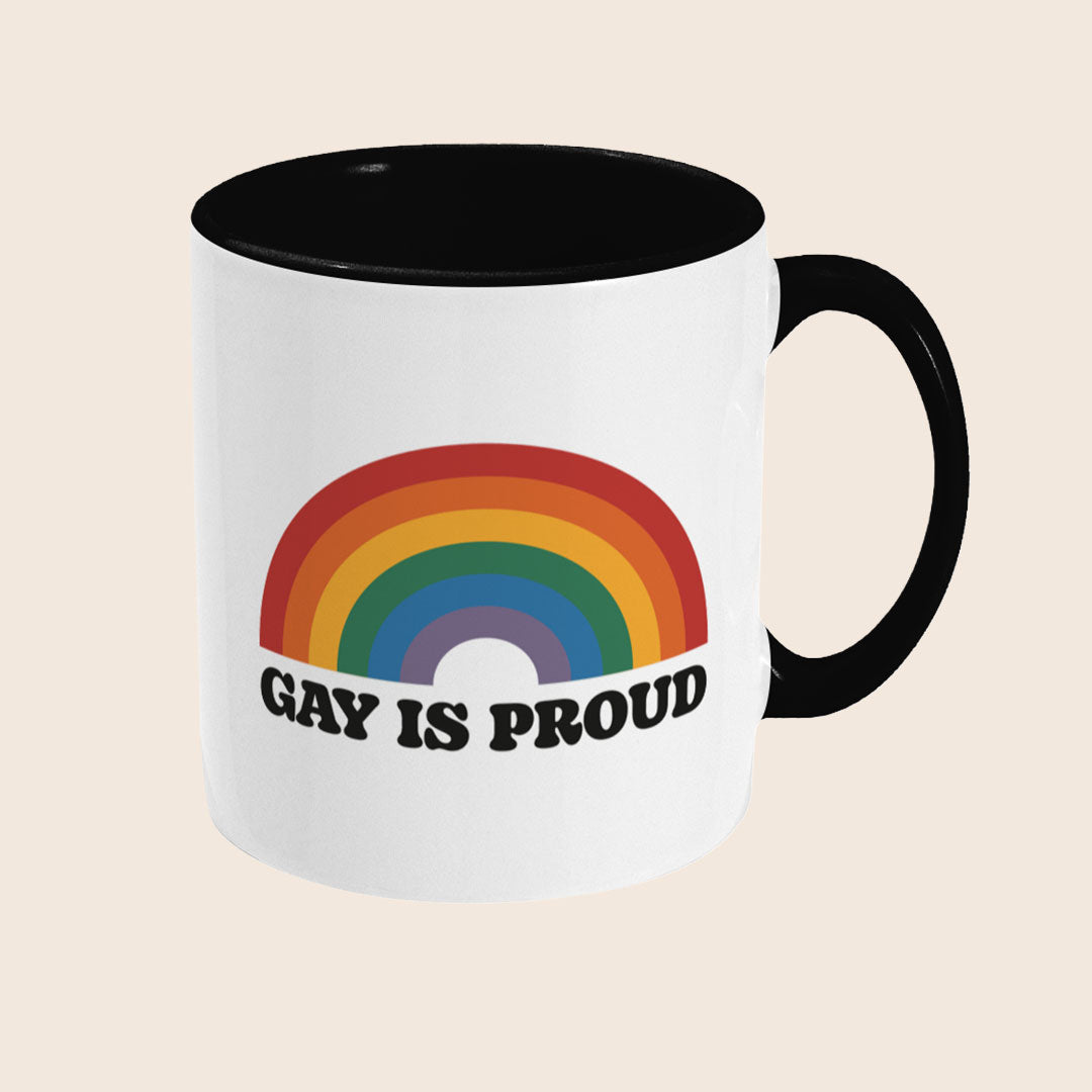 Reverse view of Gay Is Proud mug displaying the rainbow and Gay Is Proud text across the mug