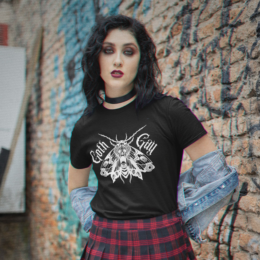 Model wearing a black Goth Gay shirt featuring a detailed white gothic moth illustration and blackletter text