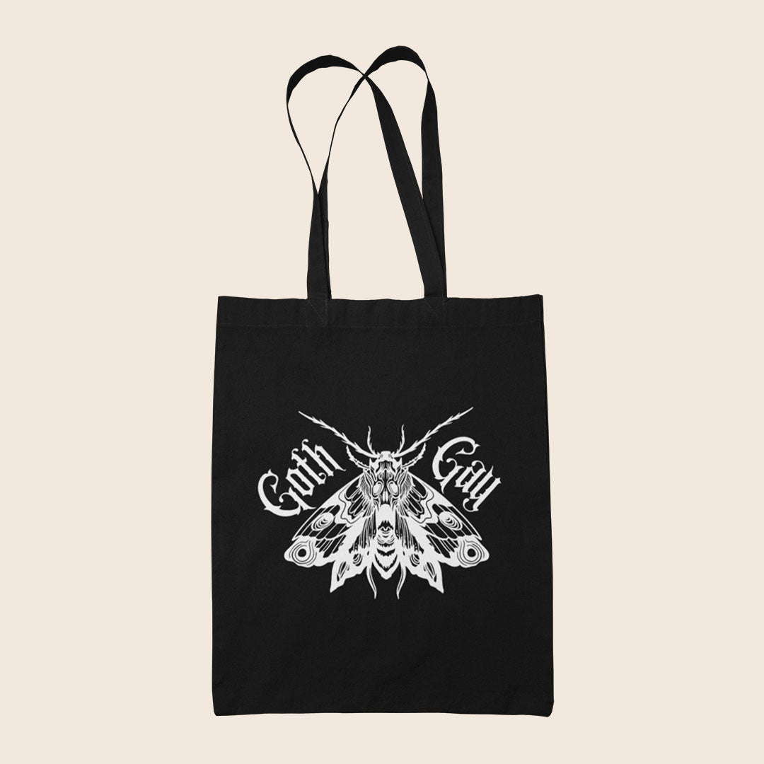 Black Goth Gay tote bag featuring a detailed white gothic moth illustration with blackletter text