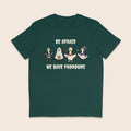 Glazed green T-shirt with four geese dressed in Halloween costumes and the words Be Afraid We Have Pronouns.