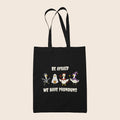 Black cotton tote bag featuring four geese in Halloween costumes with the words Be Afraid We Have Pronouns