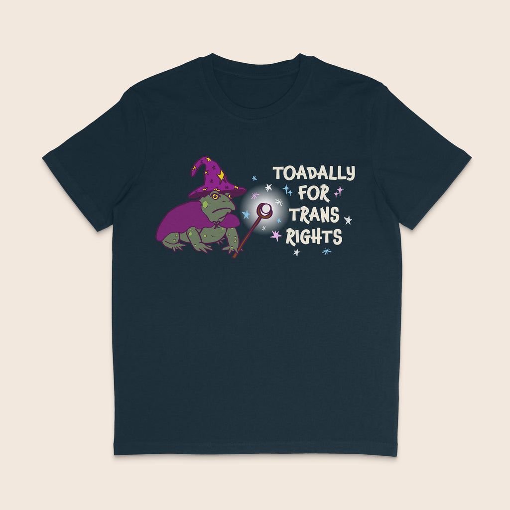 Navy T-shirt featuring a green wizard toad in a purple hat and cape with the words Toadally for Trans Rights.