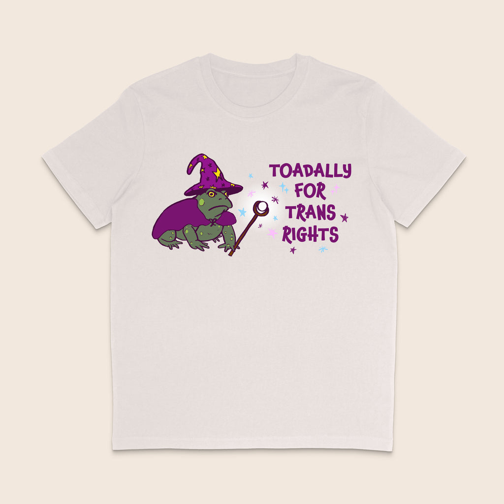 Vintage white T-shirt featuring a green wizard toad in a purple hat and cape with the words Toadally for Trans Rights.