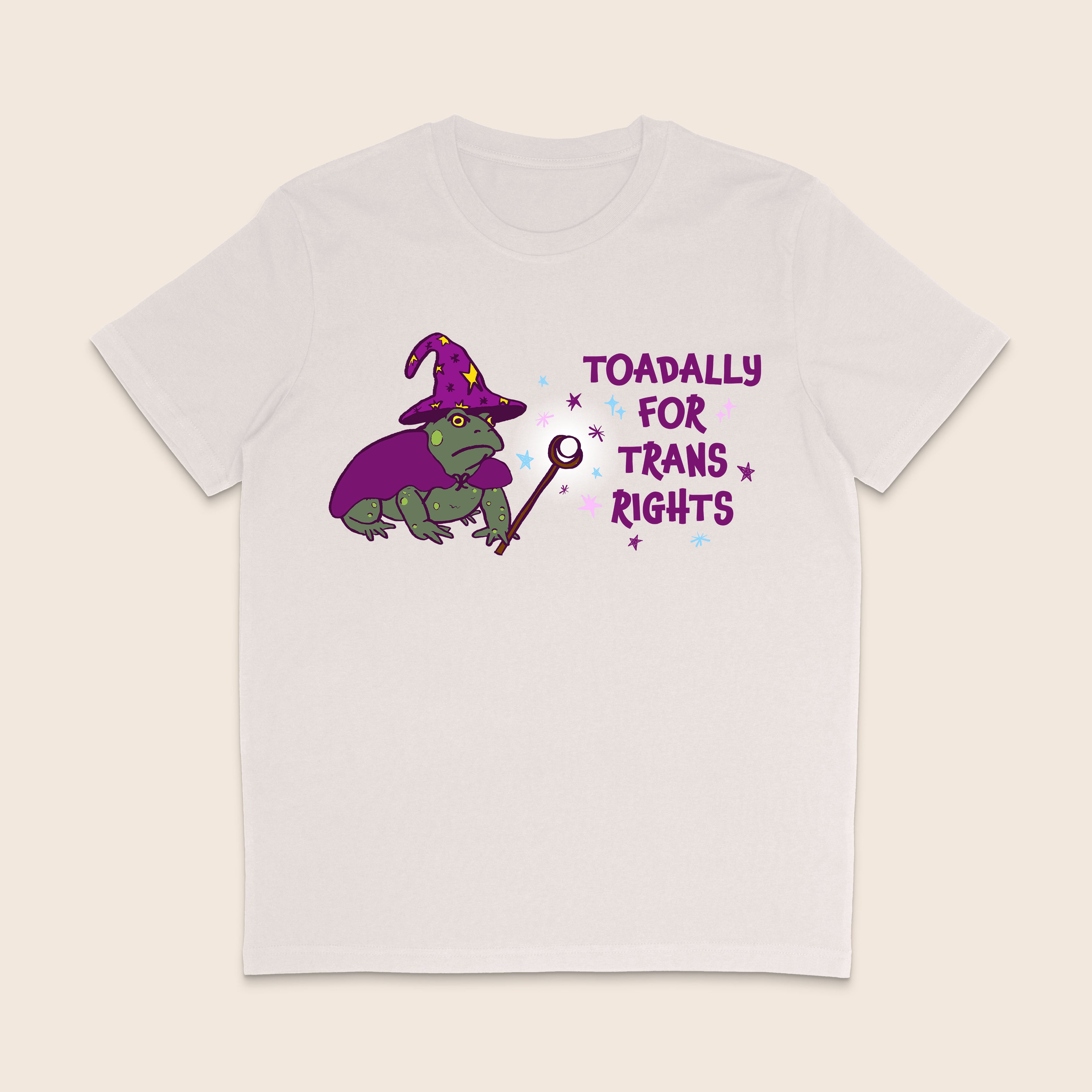 Vintage white T-shirt featuring a green wizard toad in a purple hat and cape with the words Toadally for Trans Rights.