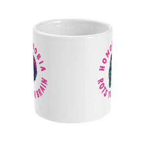 A white ceramic mug featuring a colorful, zombie-like face with pink, exposed brain matter. Surrounding the illustration is bold pink text that reads "HOMOPHOBIA ROTS YOUR BRAIN."