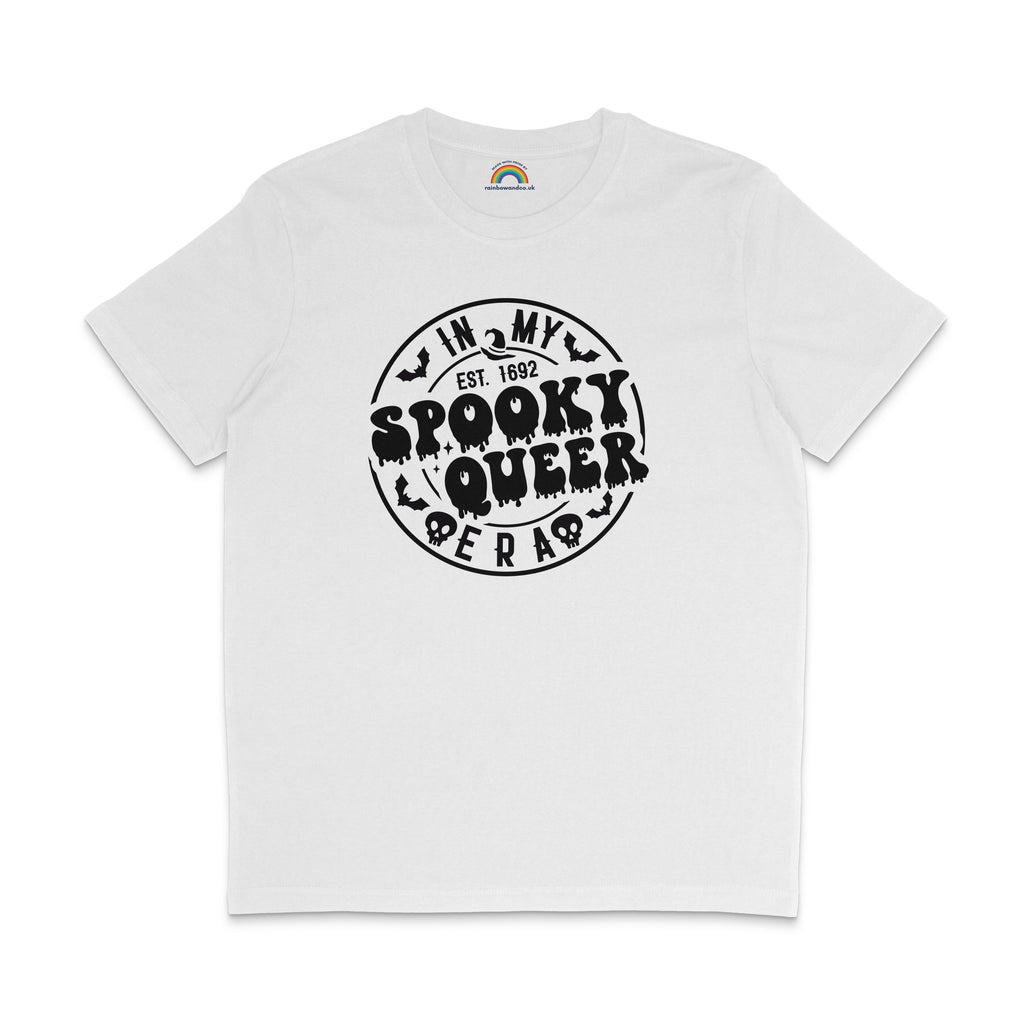 A white T-shirt with the phrase "In My Spooky Queer Era" printed in bold, dripping black letters, surrounded by bat and skull illustrations, giving a Halloween-themed look. The shirt is laid flat on a white background.