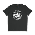 A dark heather grey T-shirt featuring the same "In My Spooky Queer Era" design in white, with dripping letters and Halloween-themed illustrations. The shirt is laid flat on a matching dark background.