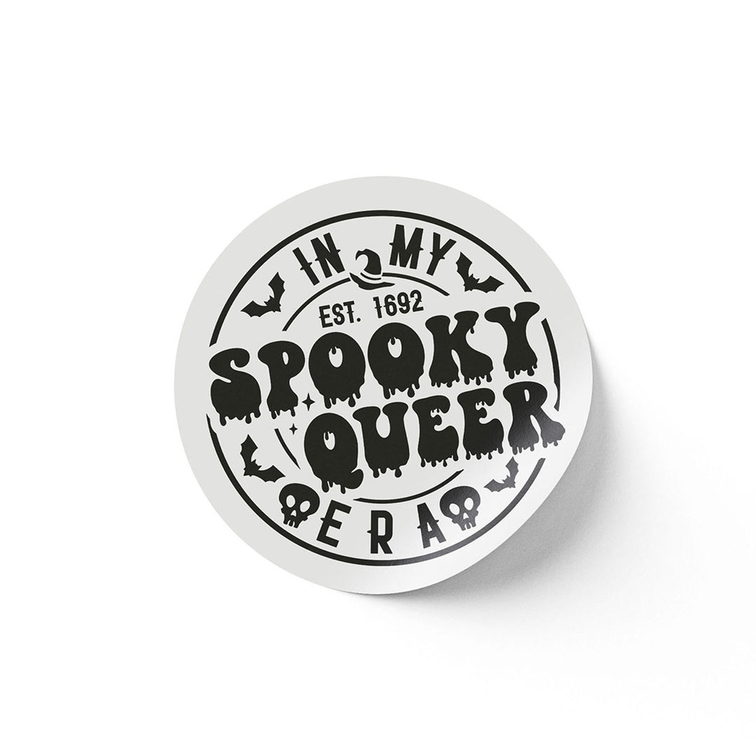 A round white sticker with black text that reads 