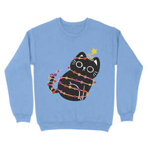 A soft, cornflower blue sweatshirt displaying a cute black cat wrapped in Christmas lights in lesbian pride colours, with a cheerful star on its tail. A subtle nod to pride during the festive season.