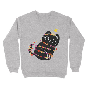 A cosy sweatshirt in heather grey featuring a playful black cat wrapped in festive Christmas lights designed in the colours of the lesbian pride flag, complete with a gold star atop its head. Perfect for subtle festive pride.