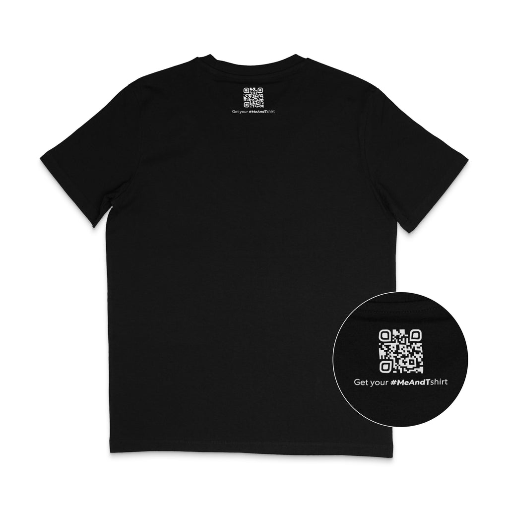 Back of a black t-shirt featuring a small white QR code printed just below the neckline, with the text “Get your #MeAndTshirt” underneath. A circular zoom-in highlights the QR detail.
