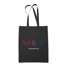 Load image into Gallery viewer, A black tote bag featuring three mummy cats in shades of pink, purple, and blue, representing the bisexual pride colours. The cats are outlined in simple, playful designs. The text &quot;rainbowandco.uk&quot; is written below the cats.