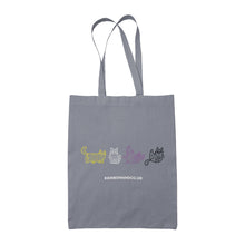 Load image into Gallery viewer, A grey tote bag with four mummy cats outlined in the non-binary pride colours: yellow, white, purple, and black. The design features the cats in different playful positions. &quot;rainbowandco.uk&quot; is written underneath.