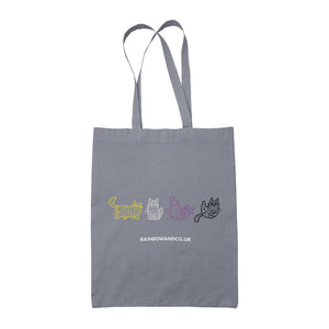 A grey tote bag with four mummy cats outlined in the non-binary pride colours: yellow, white, purple, and black. The design features the cats in different playful positions. "rainbowandco.uk" is written underneath.